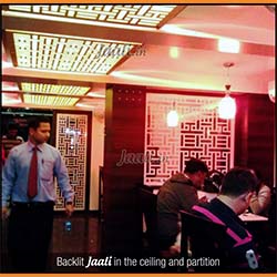 A chinese restaurant gets all its backlit MDF Jaalis in the ceiling and acrylic Jaalis as partitions a chinese design in them copy